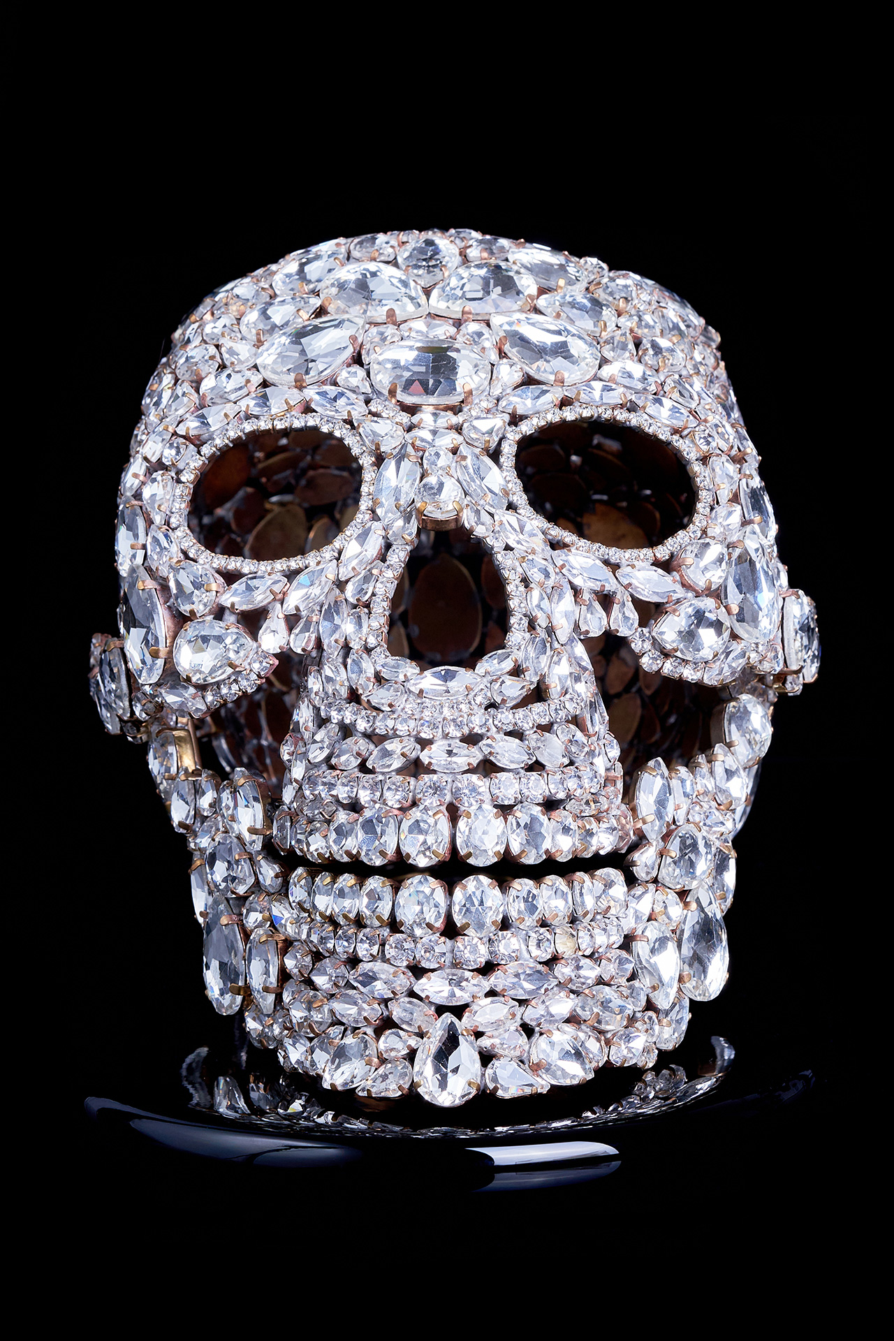 Captivating rhinestone skull with glitter decor