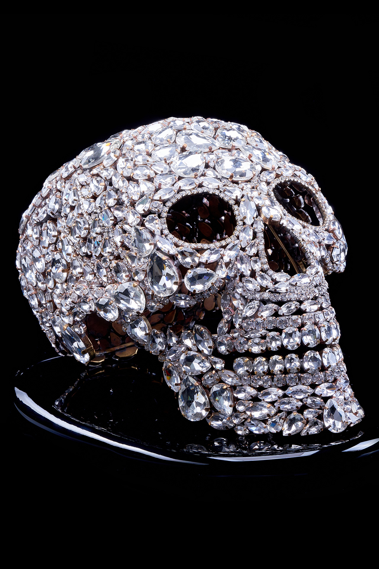 Captivating rhinestone skull with glitter decor