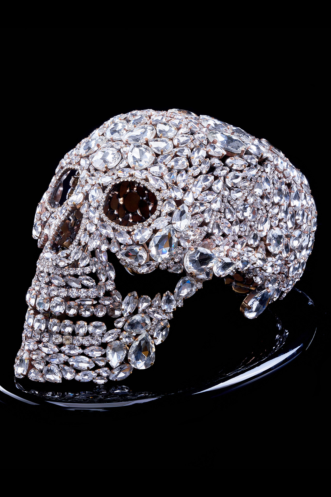 Captivating rhinestone skull with glitter decor