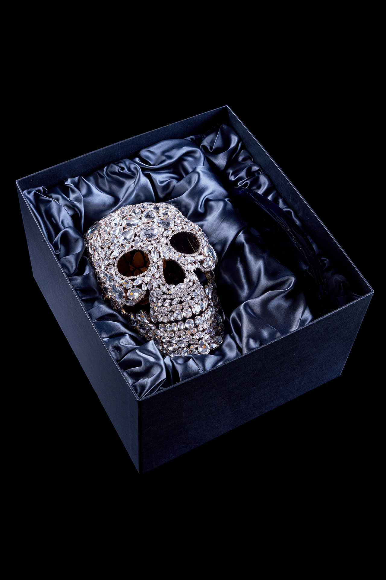 Captivating rhinestone skull with glitter decor