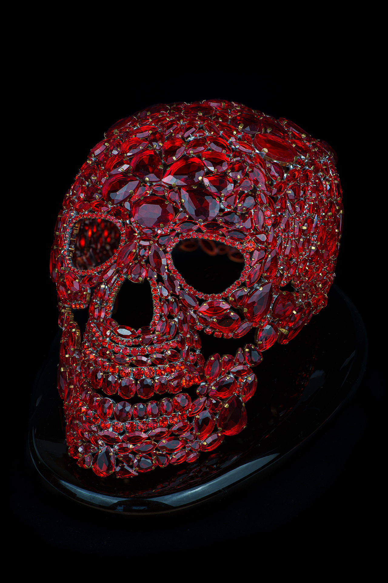 Artistic red skull made from intricately placed rhinestones