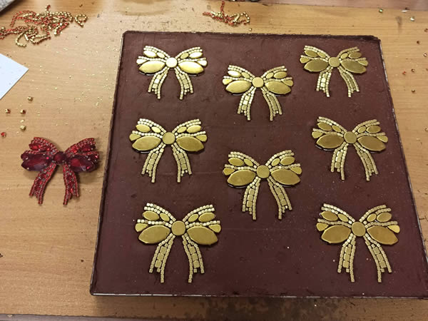 Luxury Czech Jewelry - Placing stones into decals in the passte