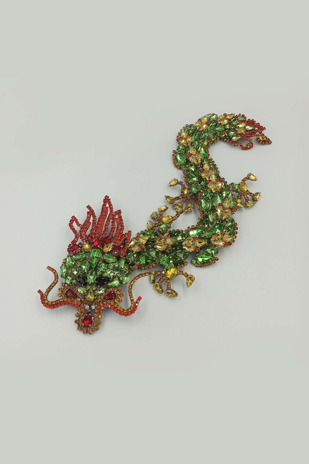 Handmade rhinestone brooch with a green Chinese dragon