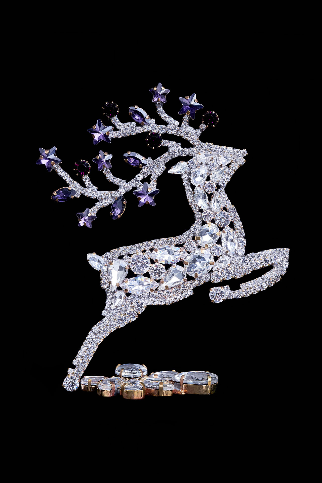 Decorative reindeer figurine with clear rhinestones - facing right