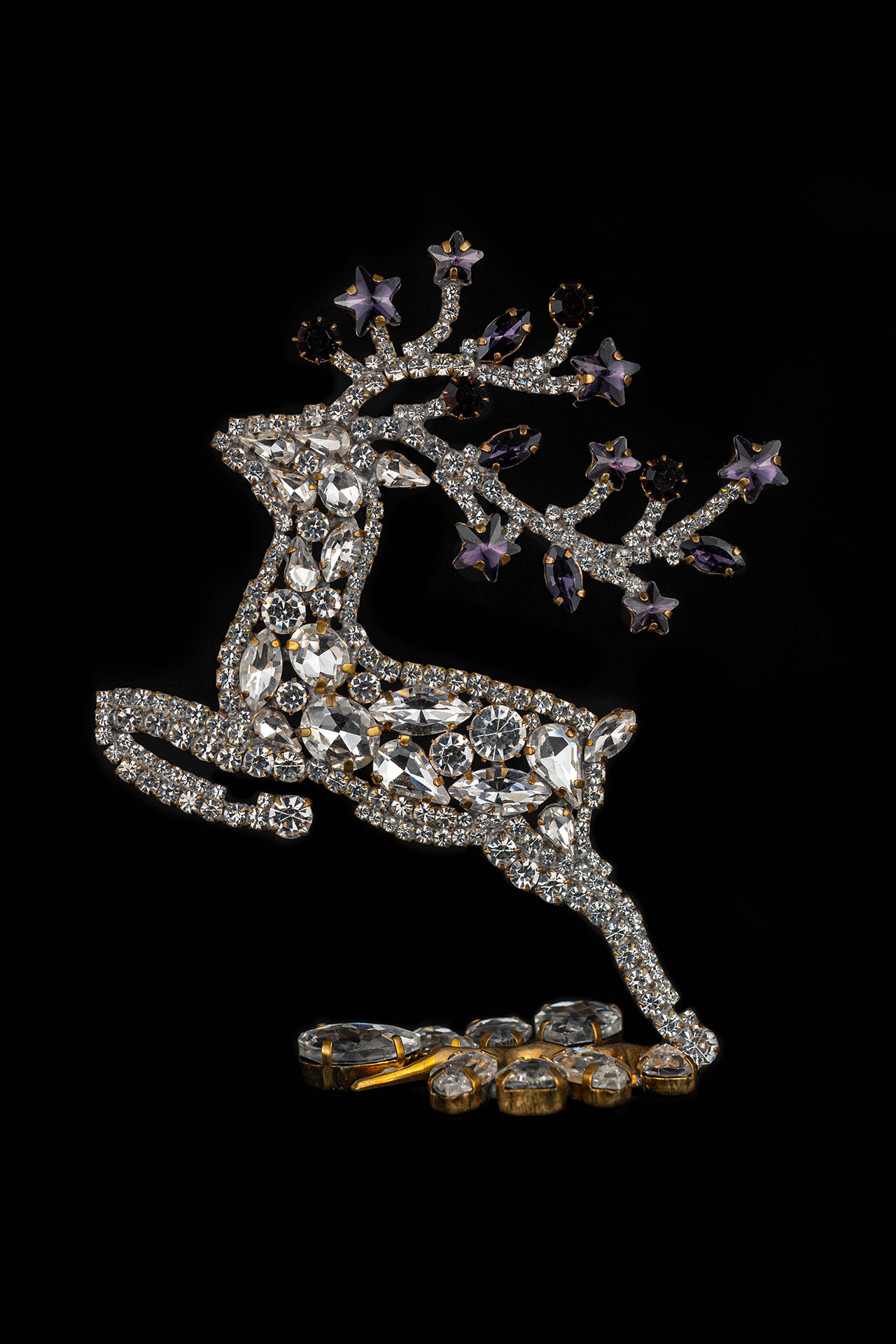 Decorative reindeer figurine with clear rhinestones - facing left