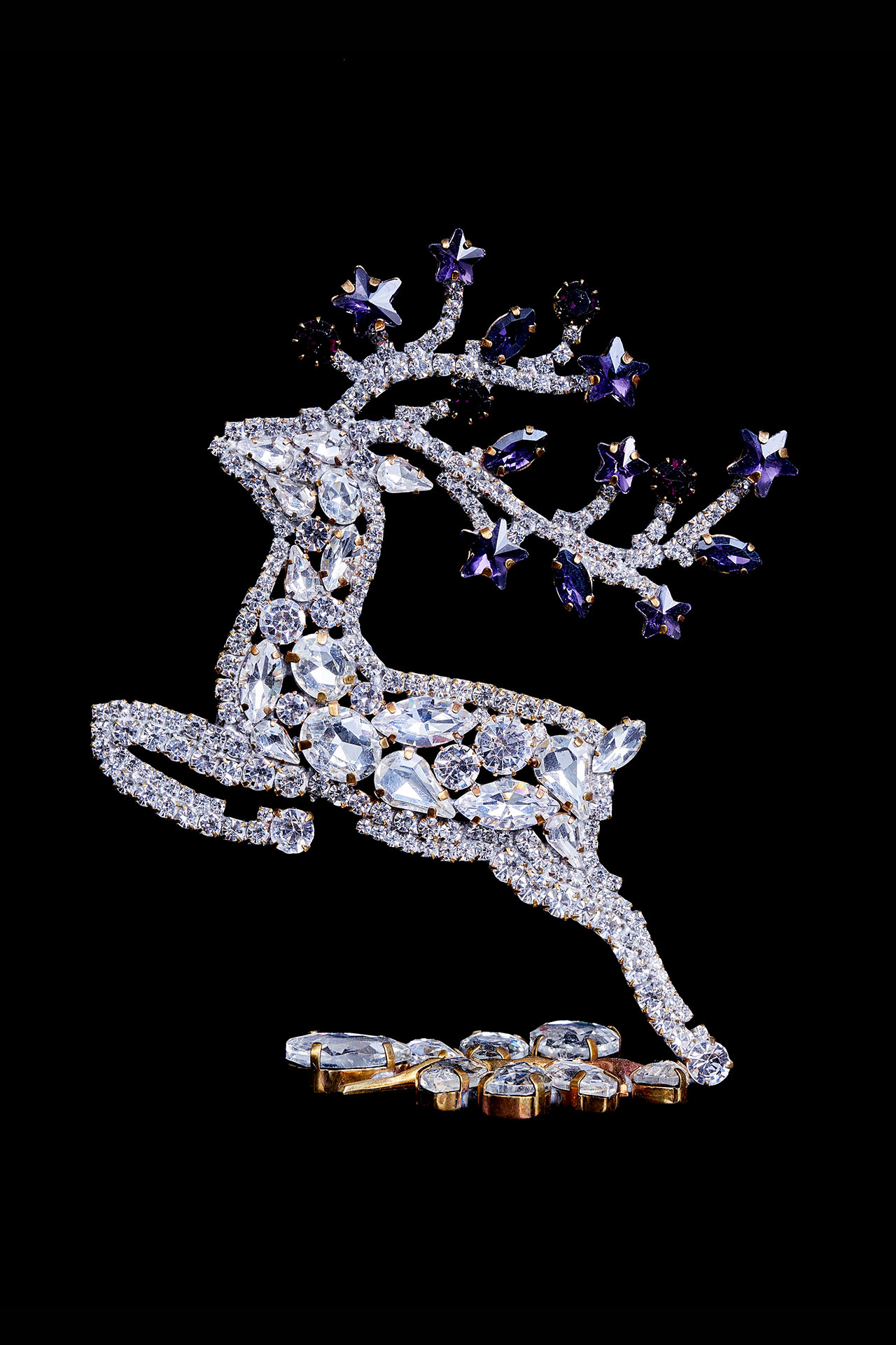 Decorative reindeer figurine with clear rhinestones - facing left