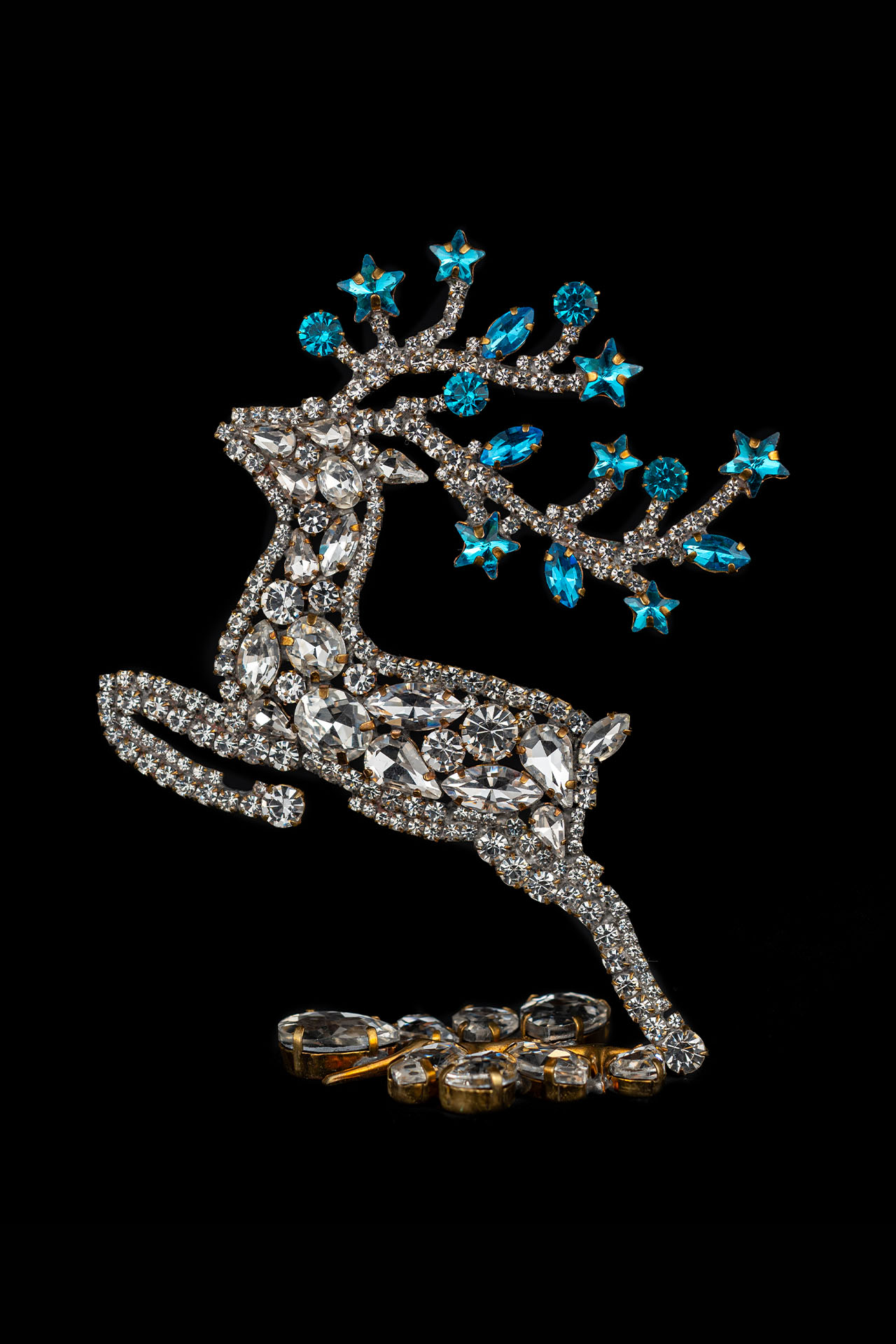 Rhinestone reindeer figurine with yellow rhinestones - facing left