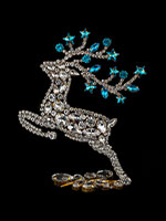 prancing reindeer blue facing left