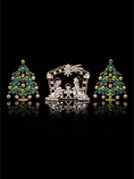 nativity scene and two dainty dazzling christmas trees green