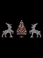 nativity scene and two dainty dazzling christmas trees festive colours