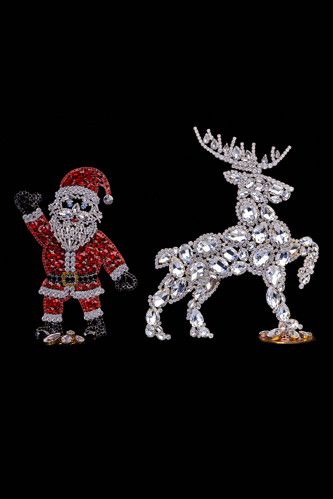 Handcrafted Christmas decoration of Santa Claus and valiant reindeer