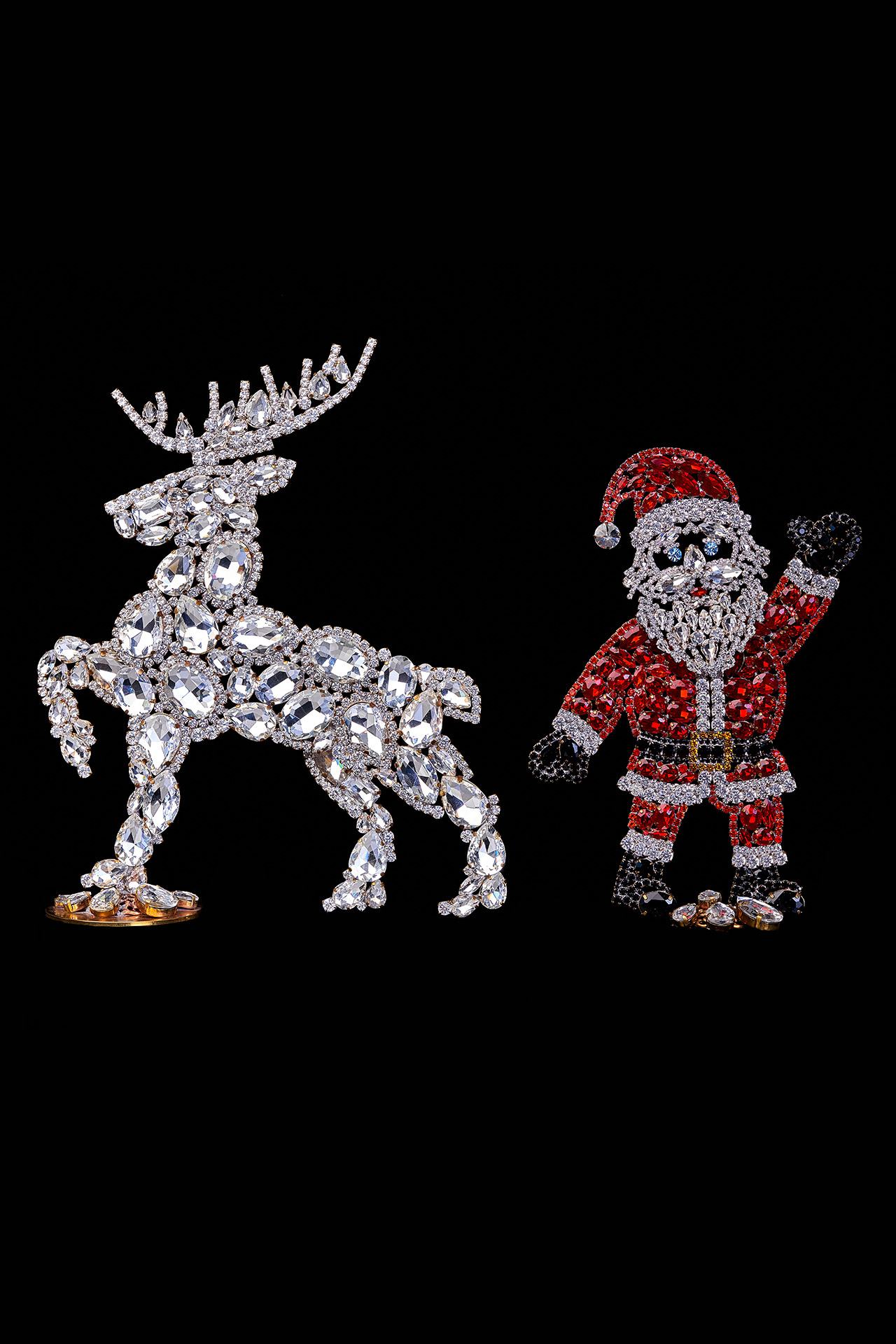 Handcrafted Christmas decoration of Santa Claus and valiant reindeer