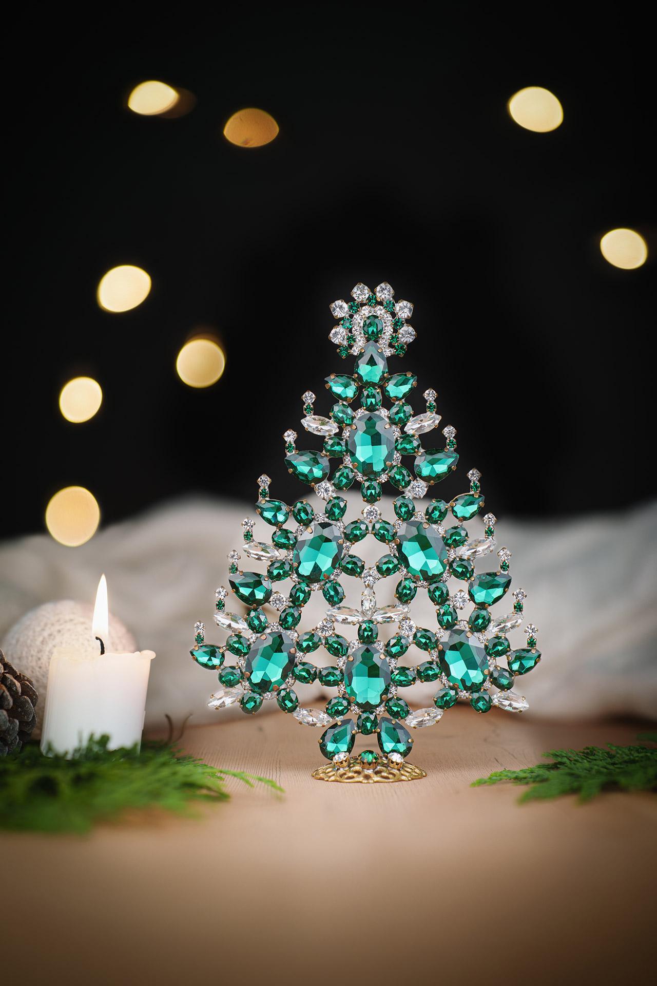 Decorated christmas tree with green rhinestones ornaments