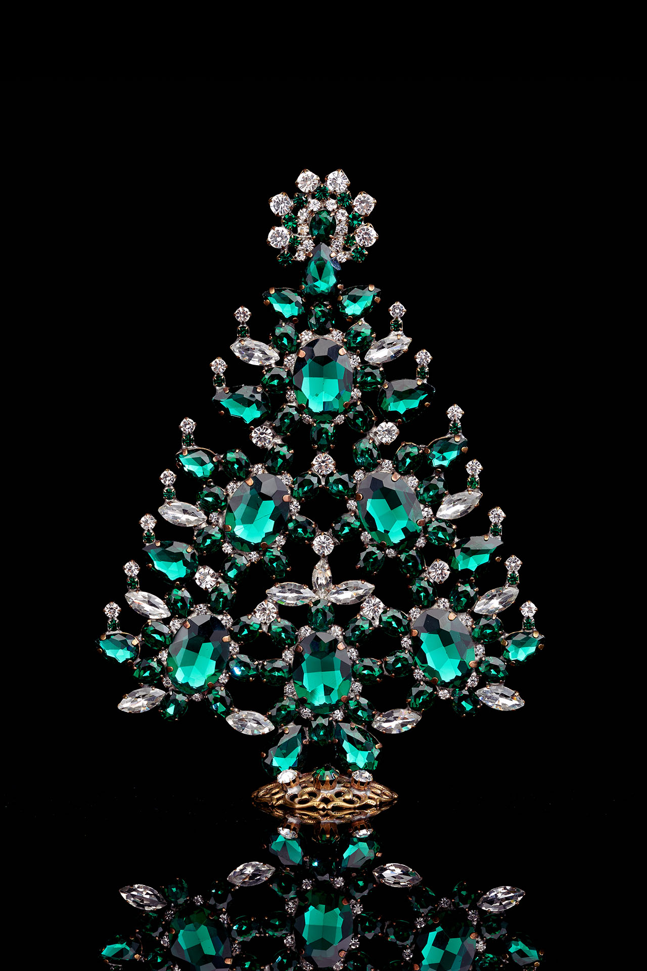 Decorated christmas tree with green rhinestones ornaments