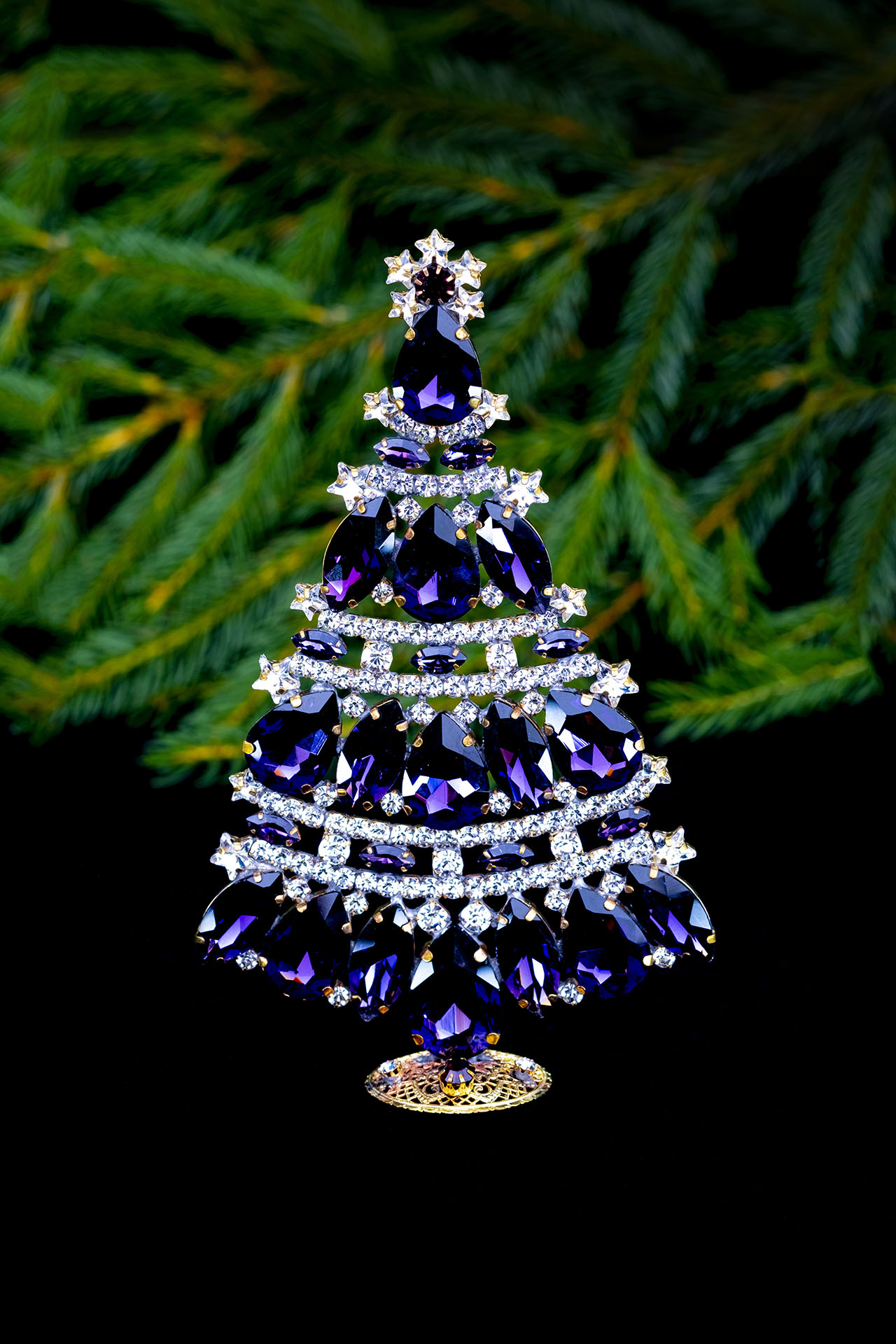 Pretty christmas tree handcrafted with purple rhinestones