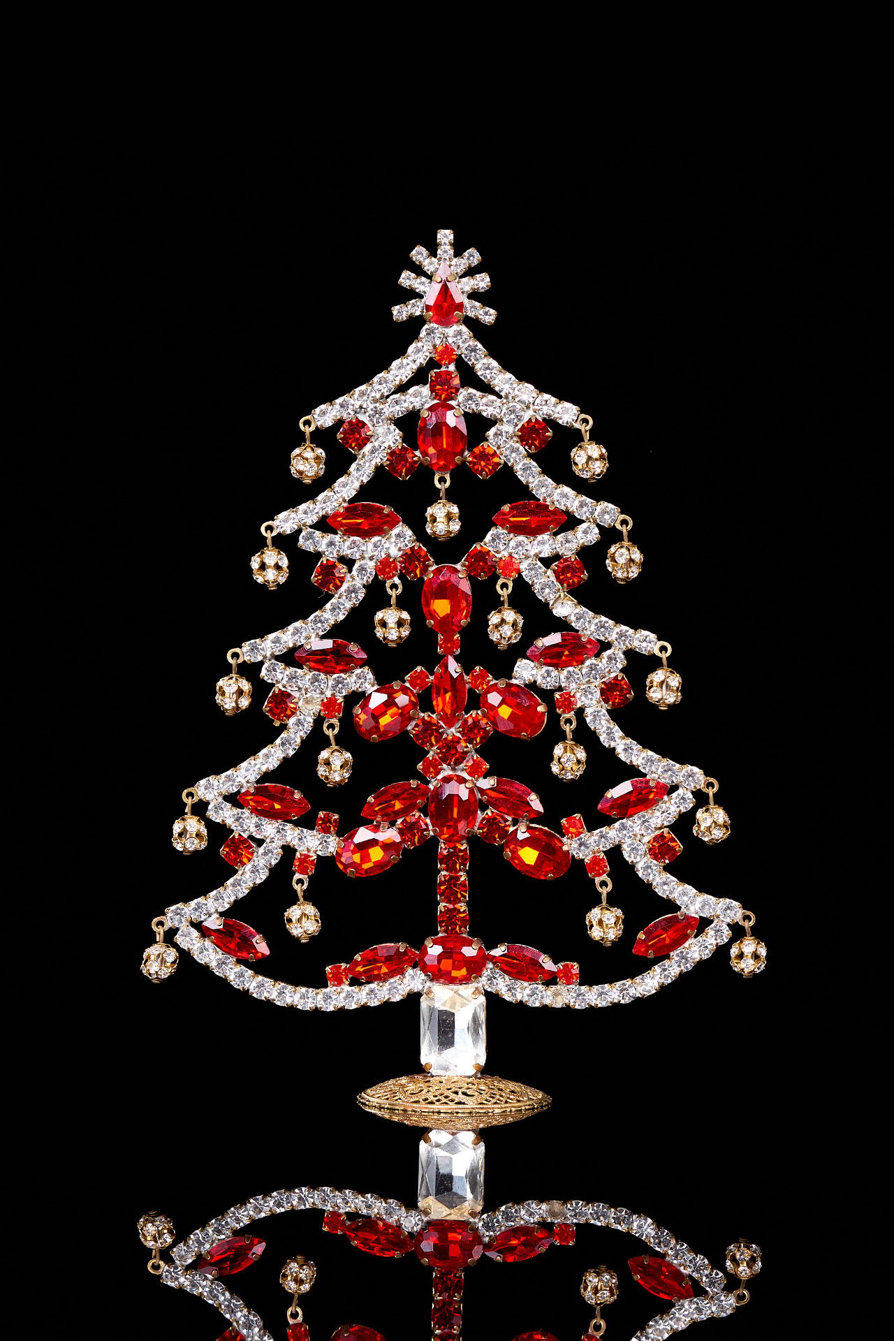 Crystalline Christmas tree decorated from red rhinestones