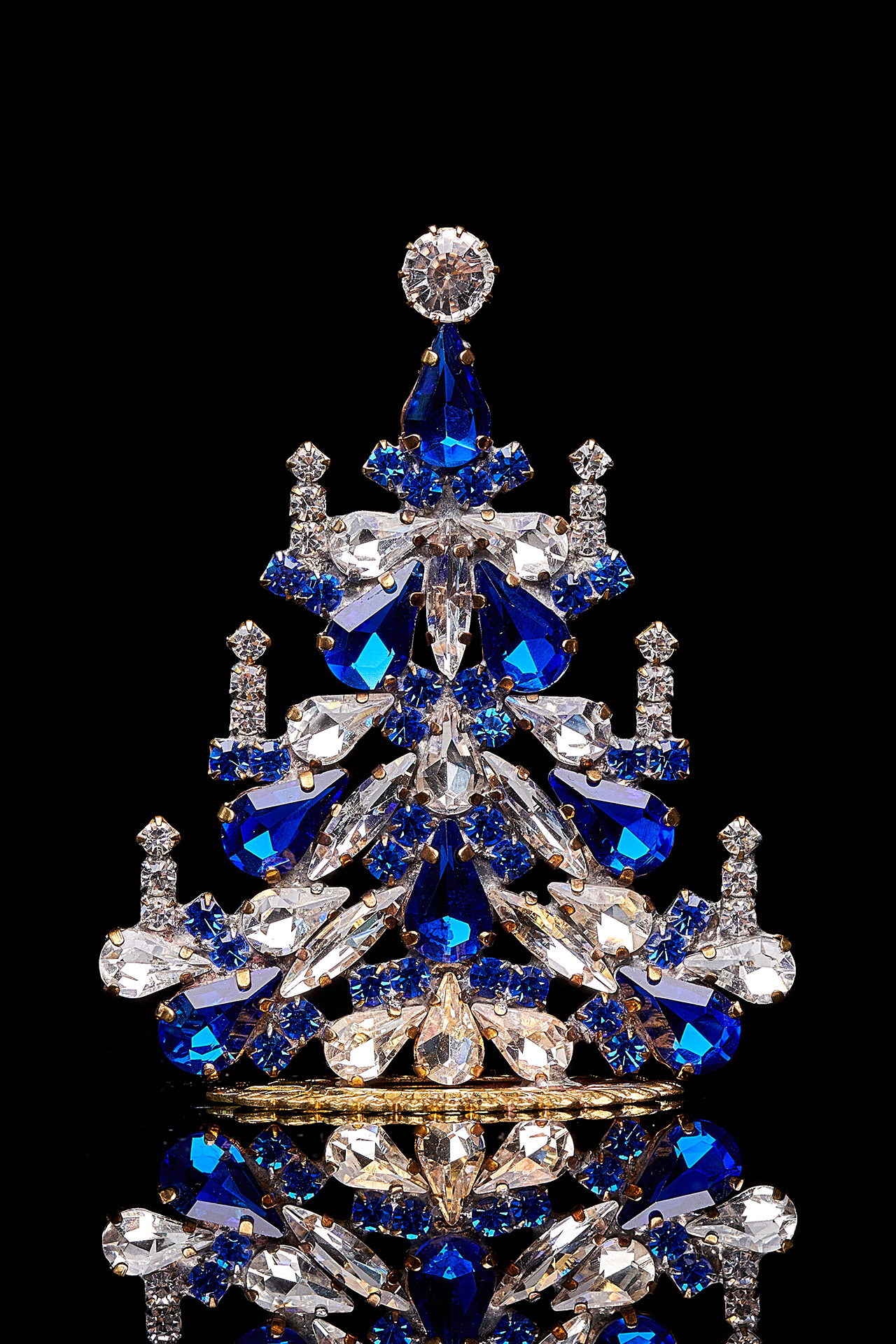 Handcrafted festive Christmas tree with blue rhinestones