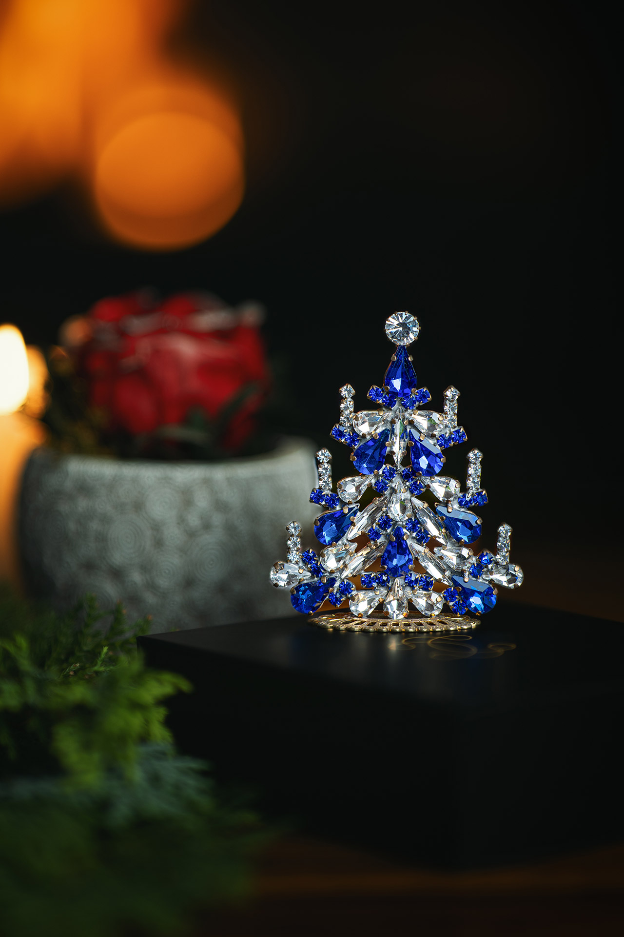 Handcrafted festive Christmas tree with blue rhinestones