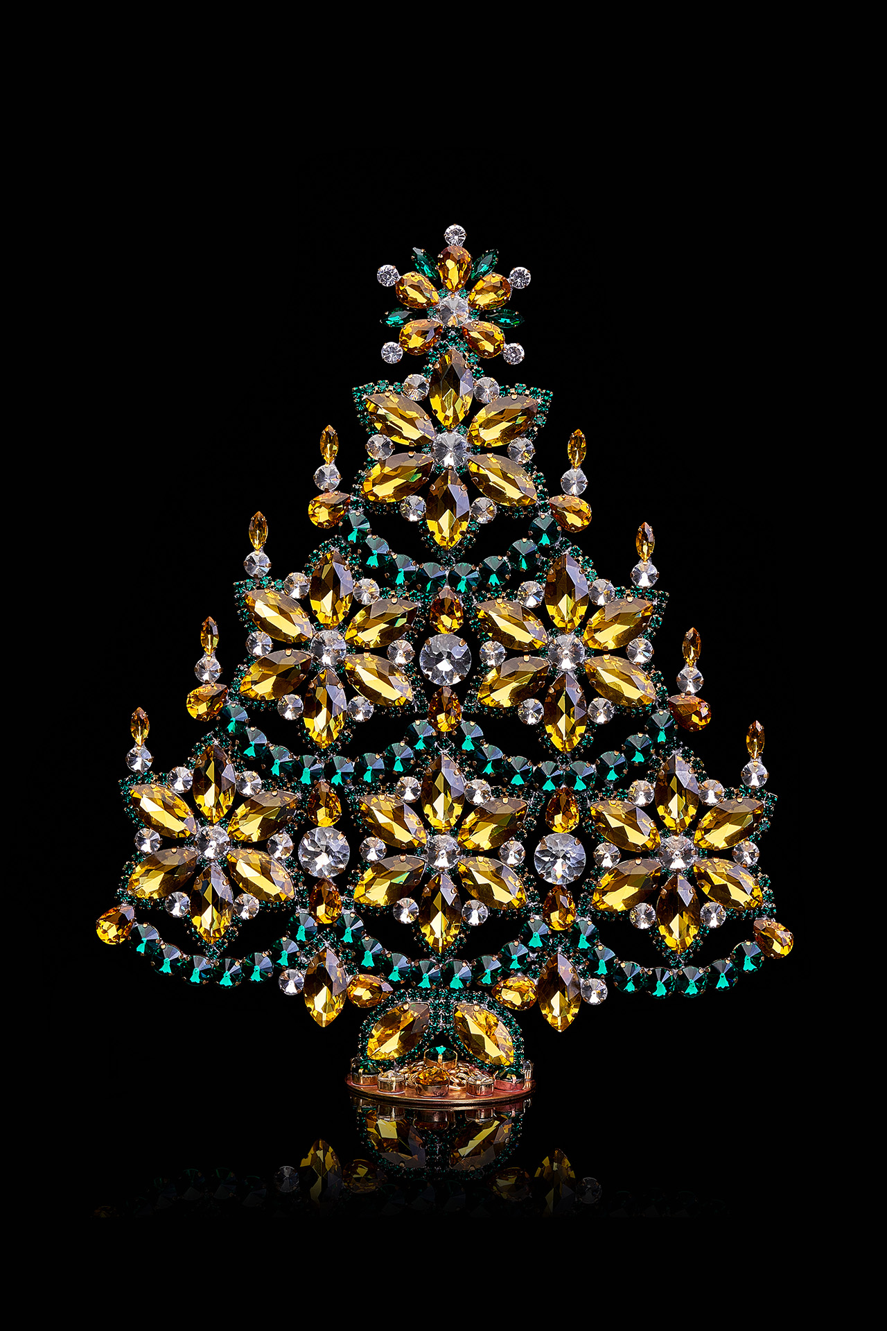 Handmade gold and green Christmas tree with snowflakes and candles