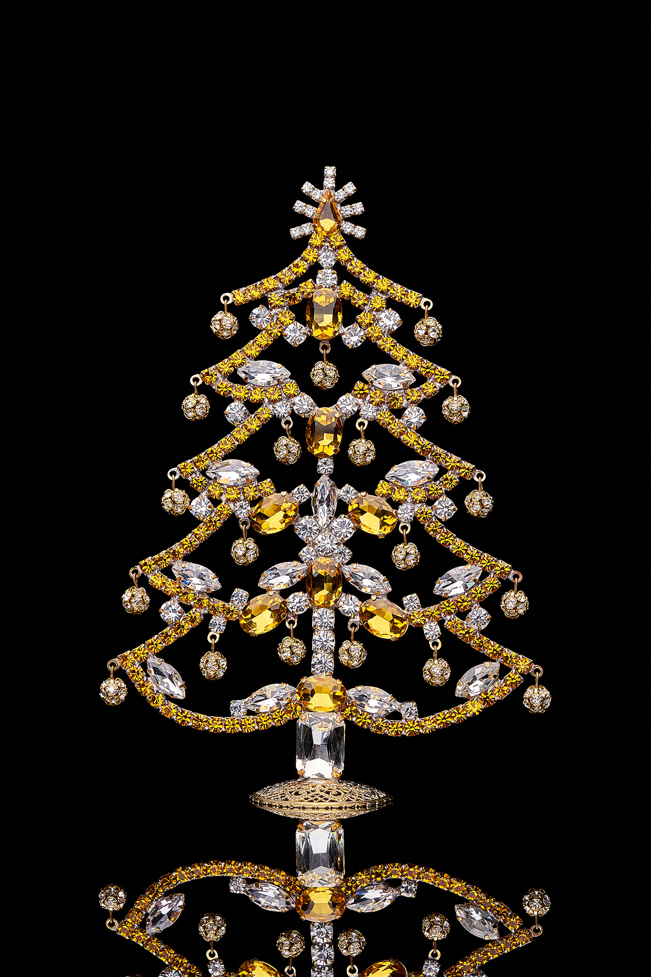 Crystalline Christmas tree decorated from yellow rhinestones