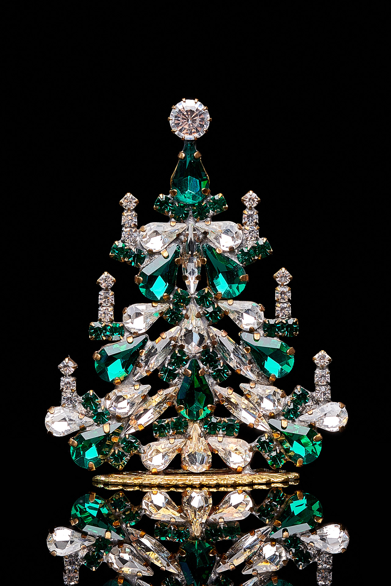 Handcrafted festive Christmas tree with green rhinestones