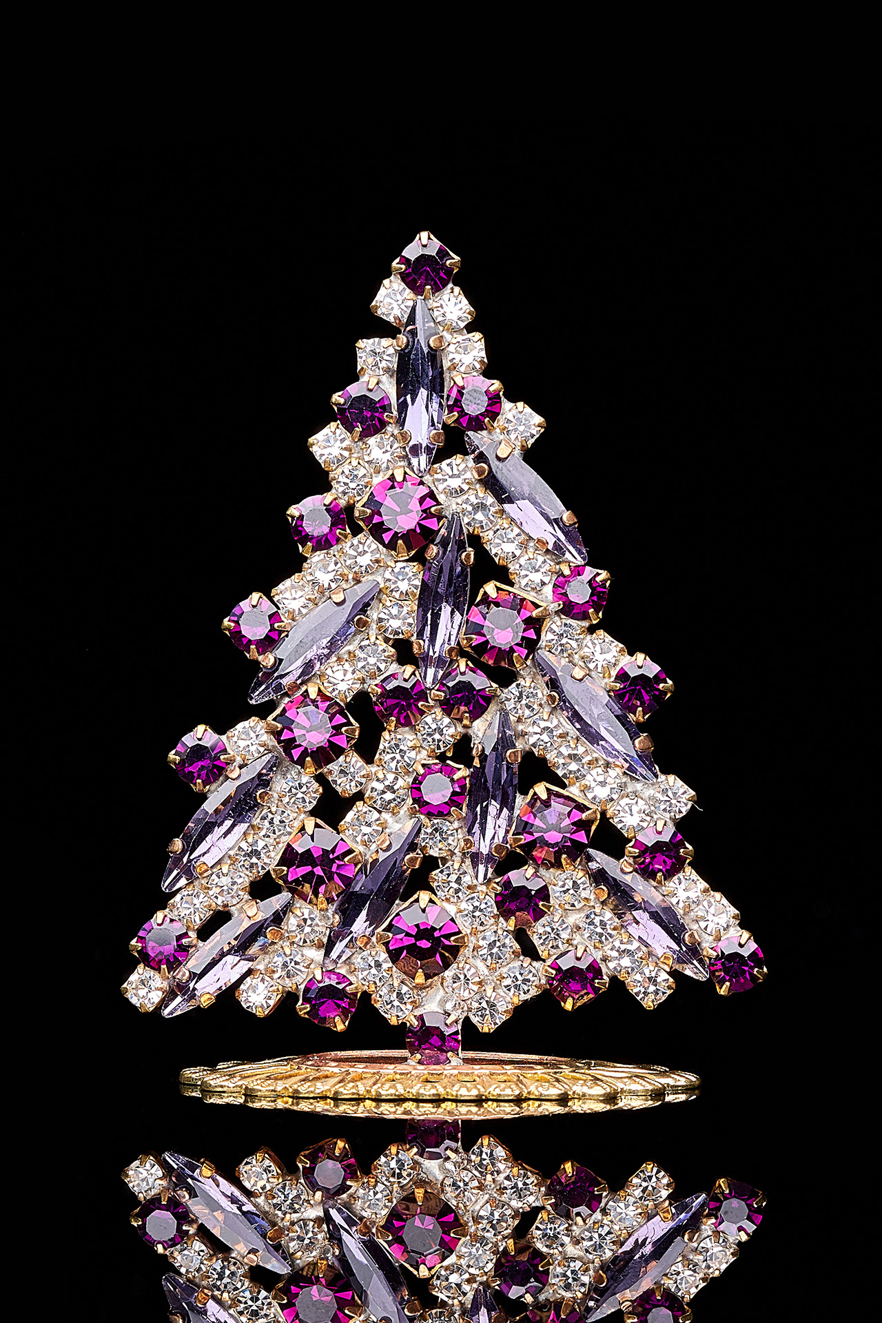 Magical tabletop Christmas tree handcrafted with purple rhinestones