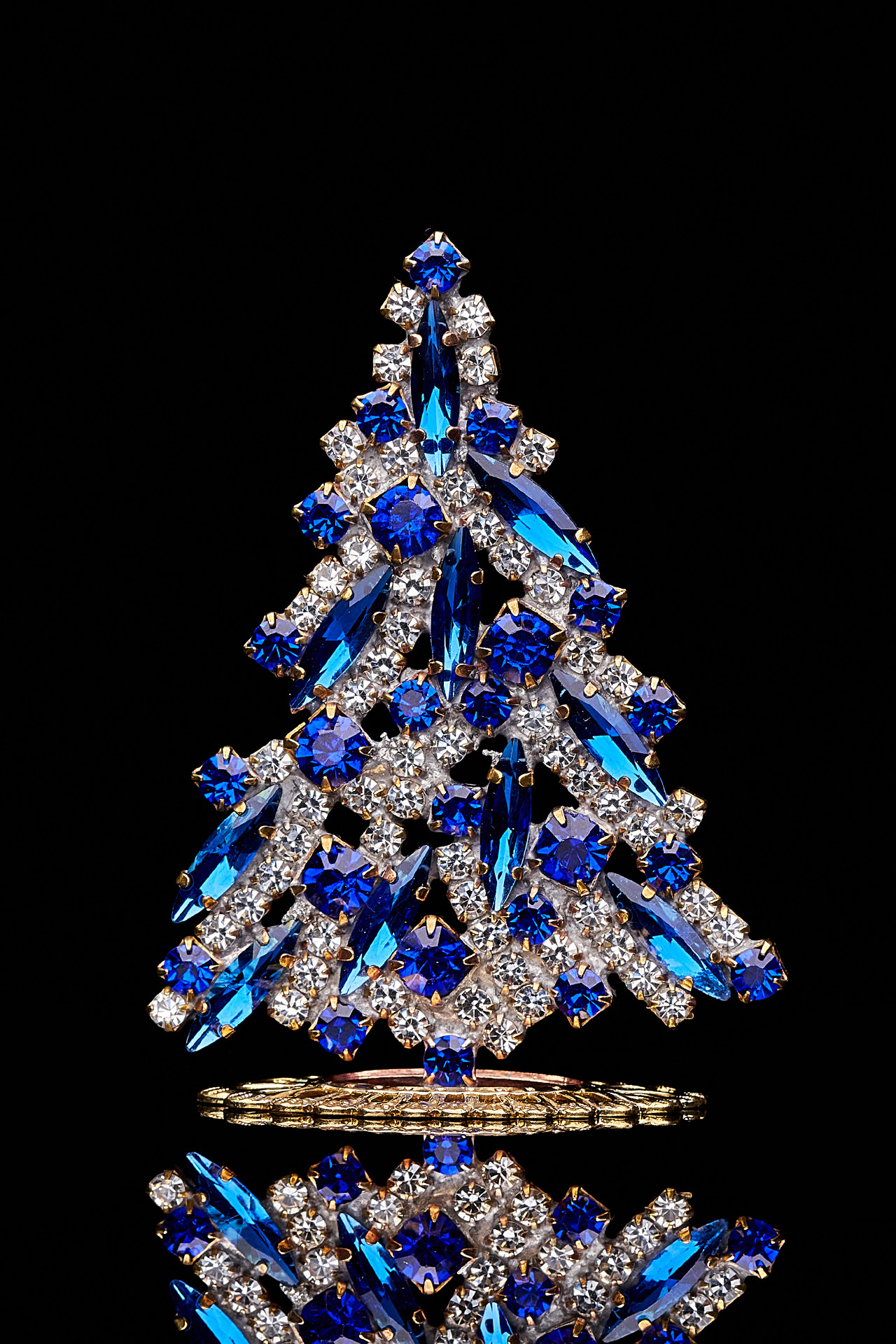 Magical tabletop Christmas tree handcrafted with blue rhinestones