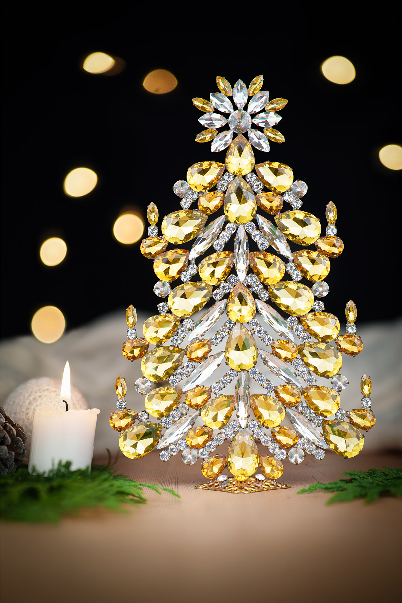Festive tabletop Christmas tree with yellow rhinestones