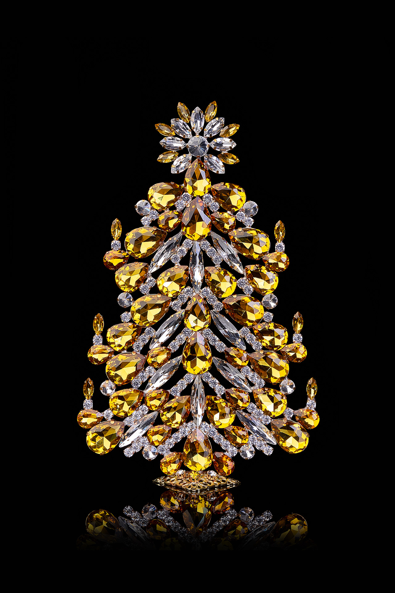 Festive tabletop Christmas tree with yellow rhinestones