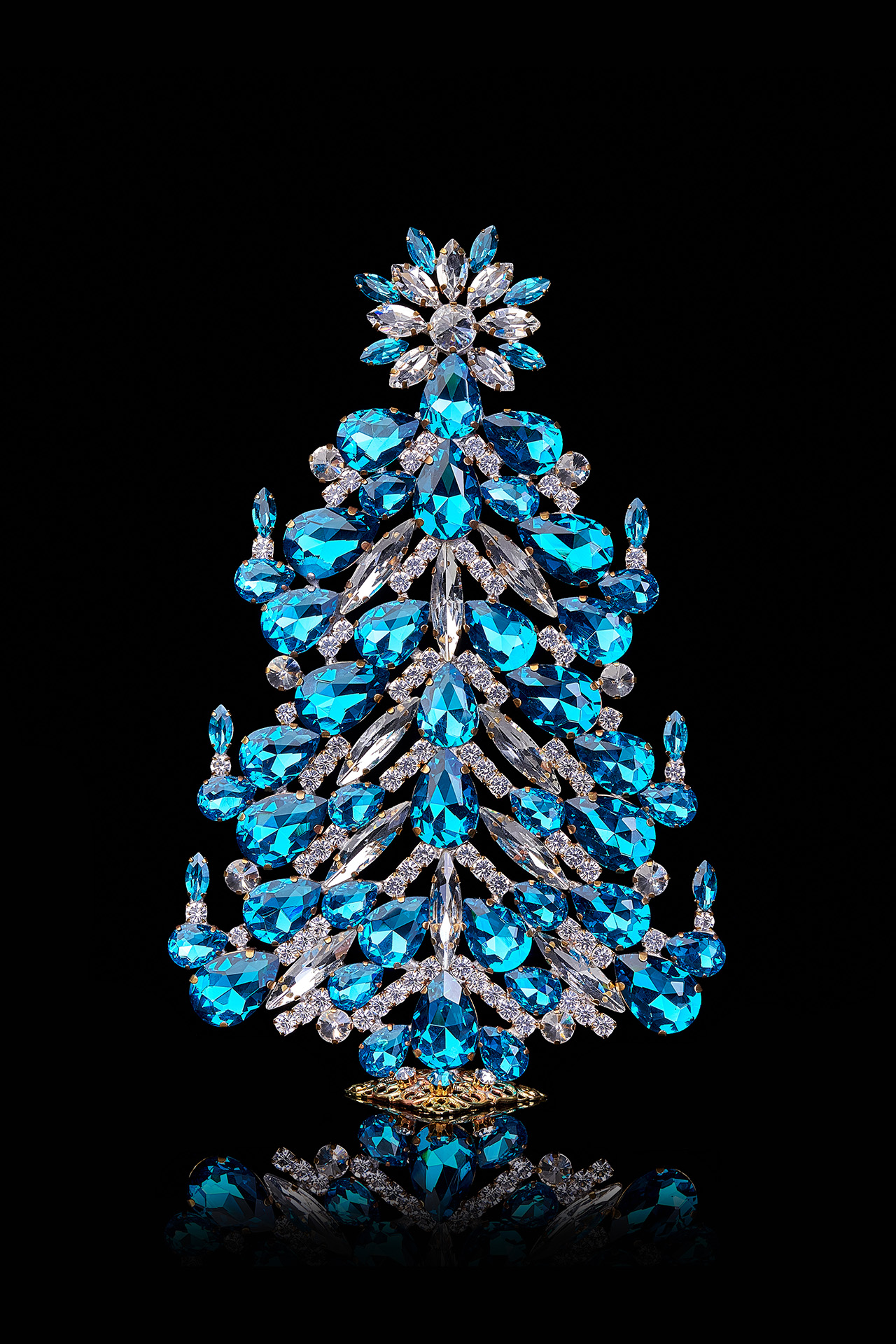 Festive tabletop Christmas tree with aqua rhinestones