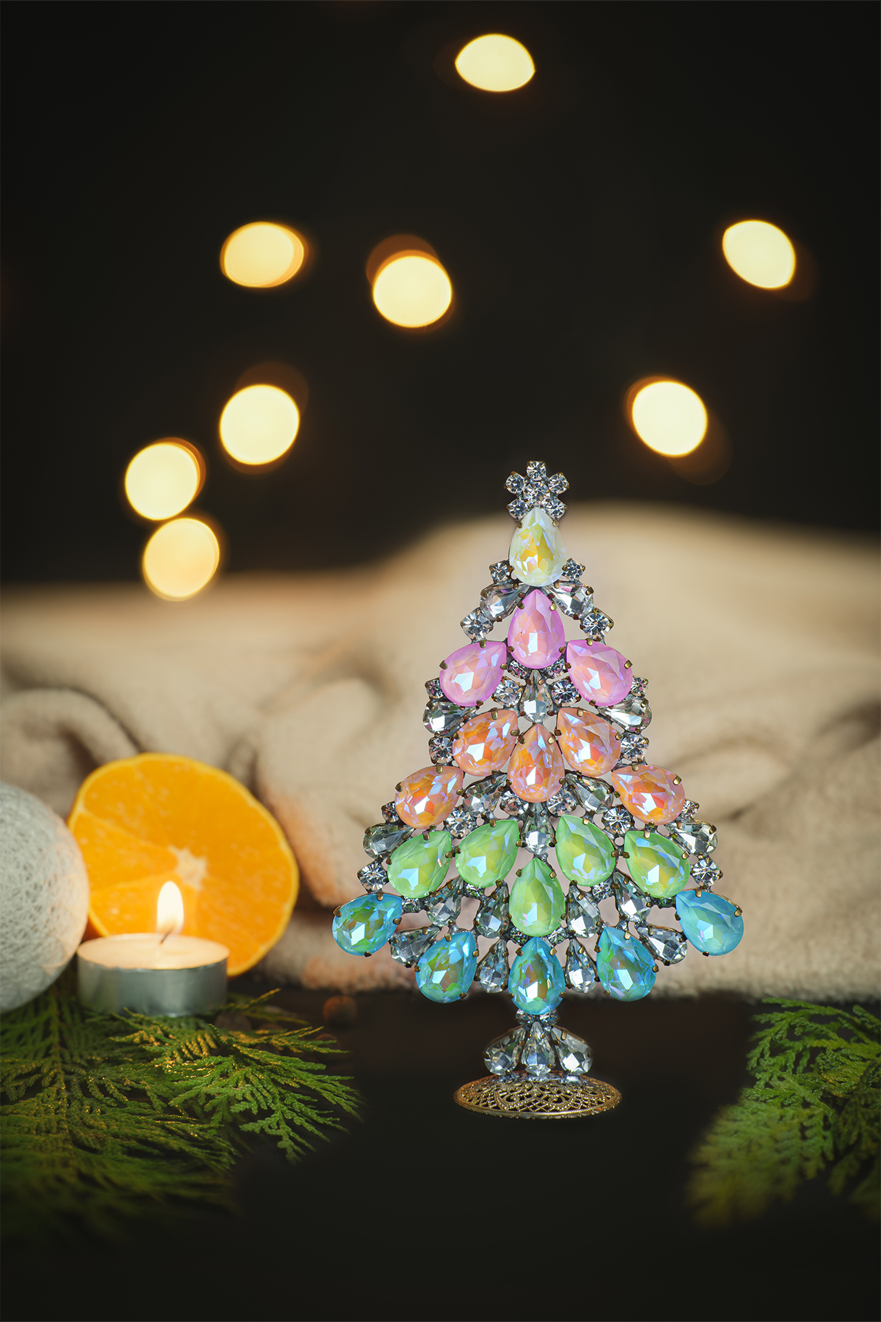 Christmas tree made of rhinestones and opal stones in rainbow color
