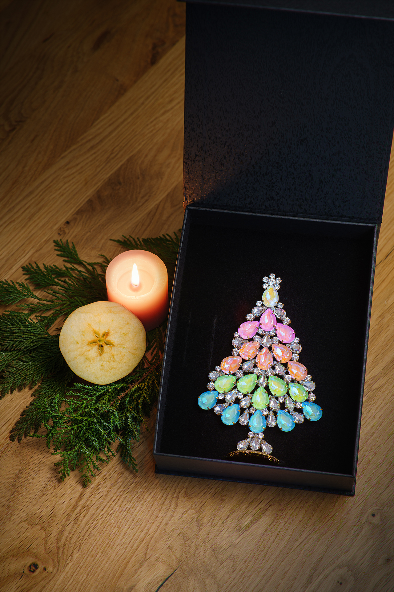 Christmas tree made of rhinestones and opal stones in rainbow color