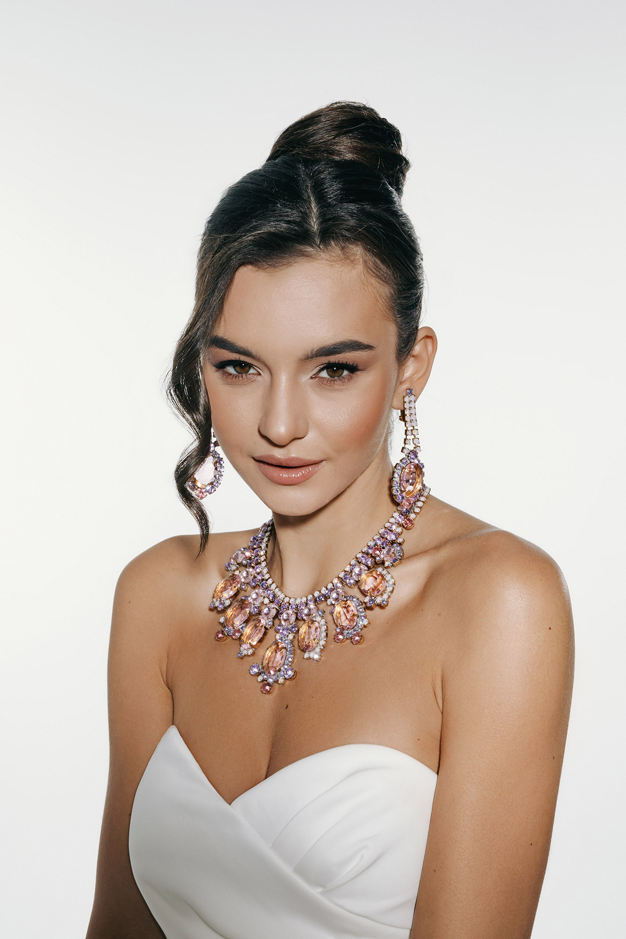 Rhinestone necklace and earrings with pink oval crystals