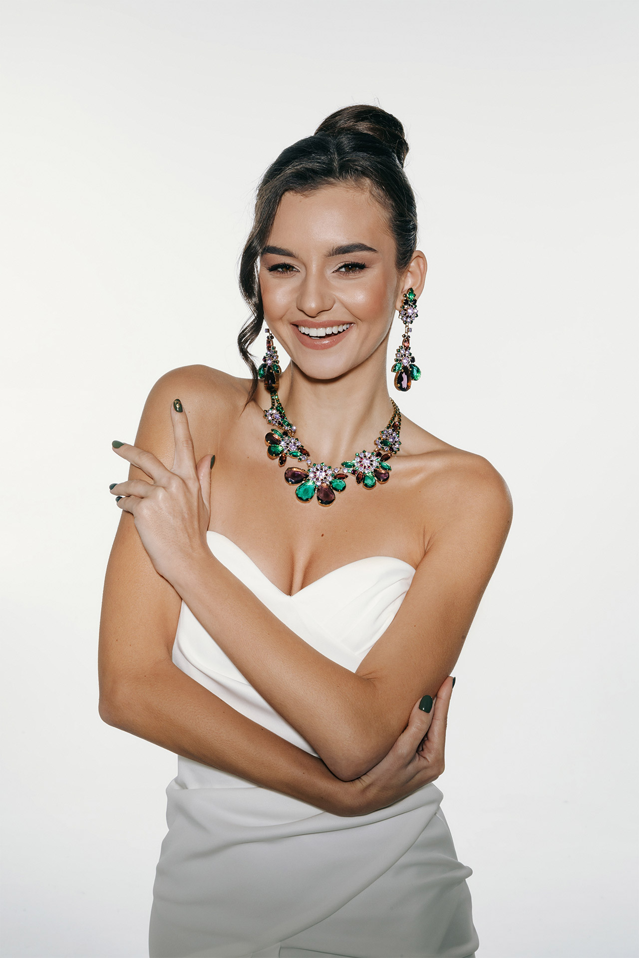 Rhinestone necklace and earrings with green and purple crystals