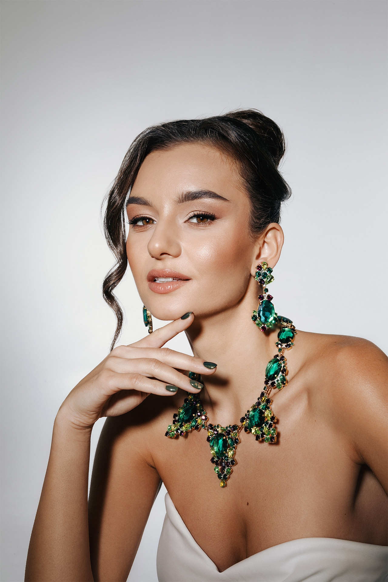 Rhinestone necklace and earrings with rich green and purple accents