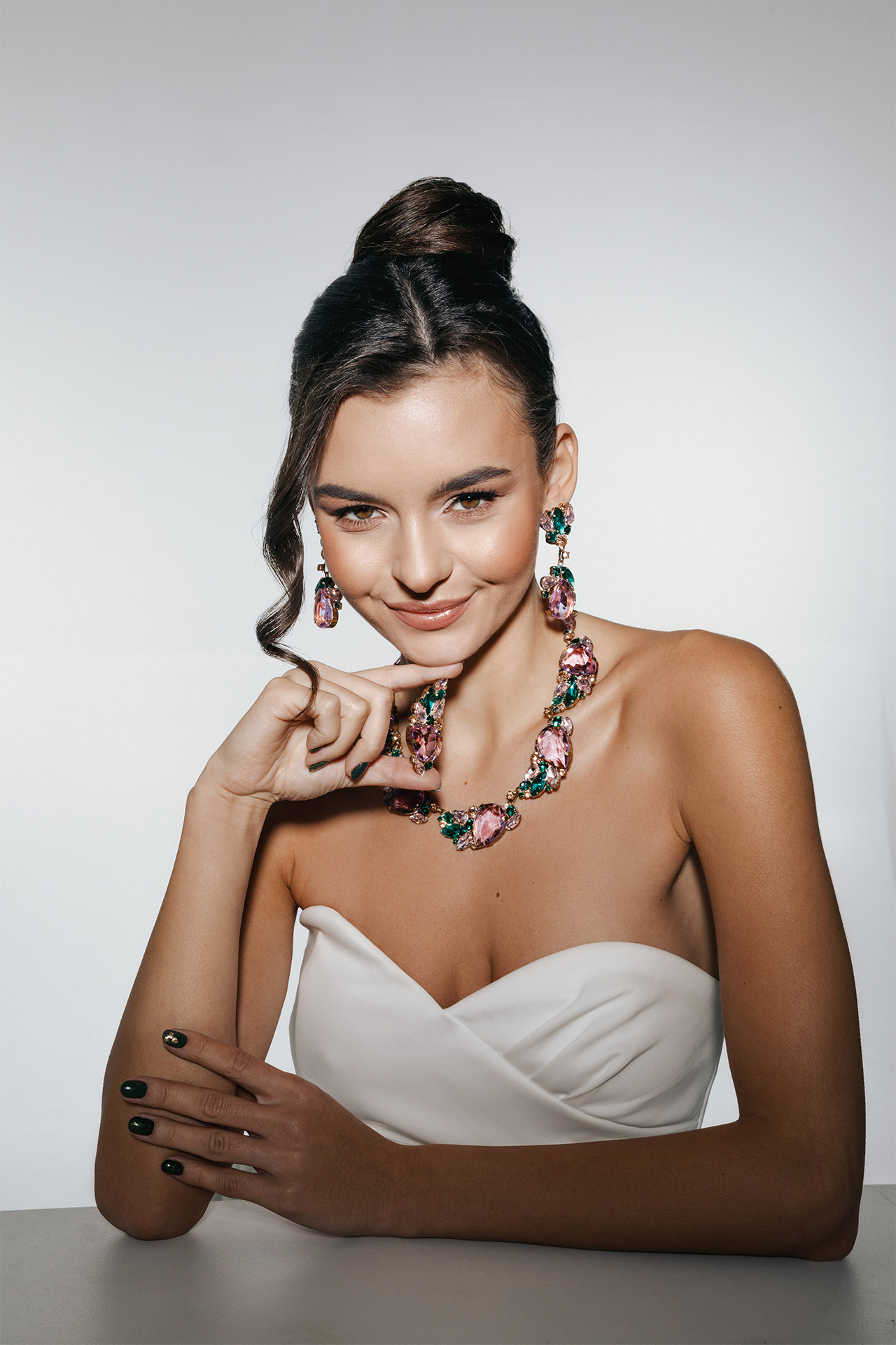 Rhinestone necklace and earrings with leaf and budding flower motif