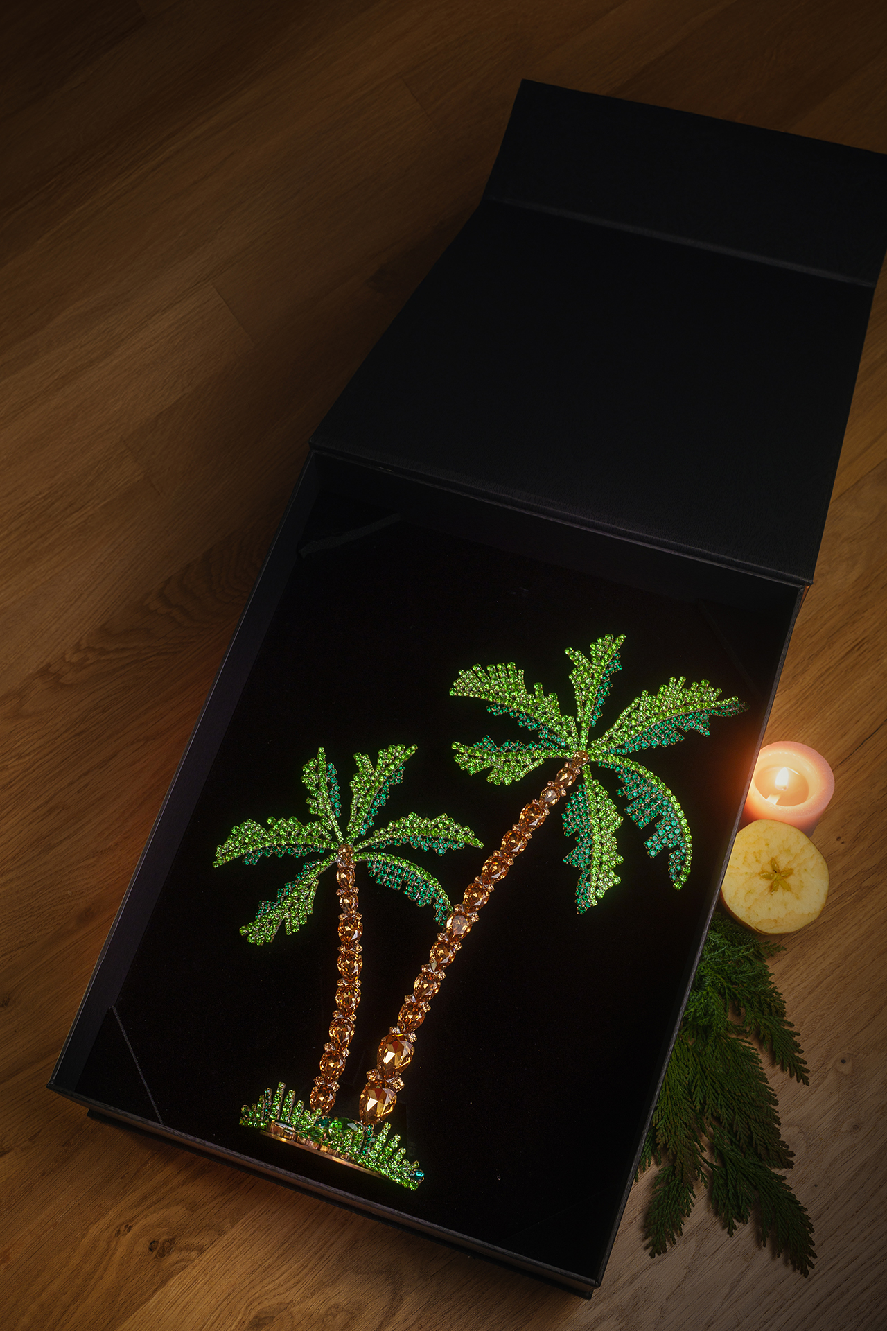 Rhinestone palm trees placed on a grass-like base