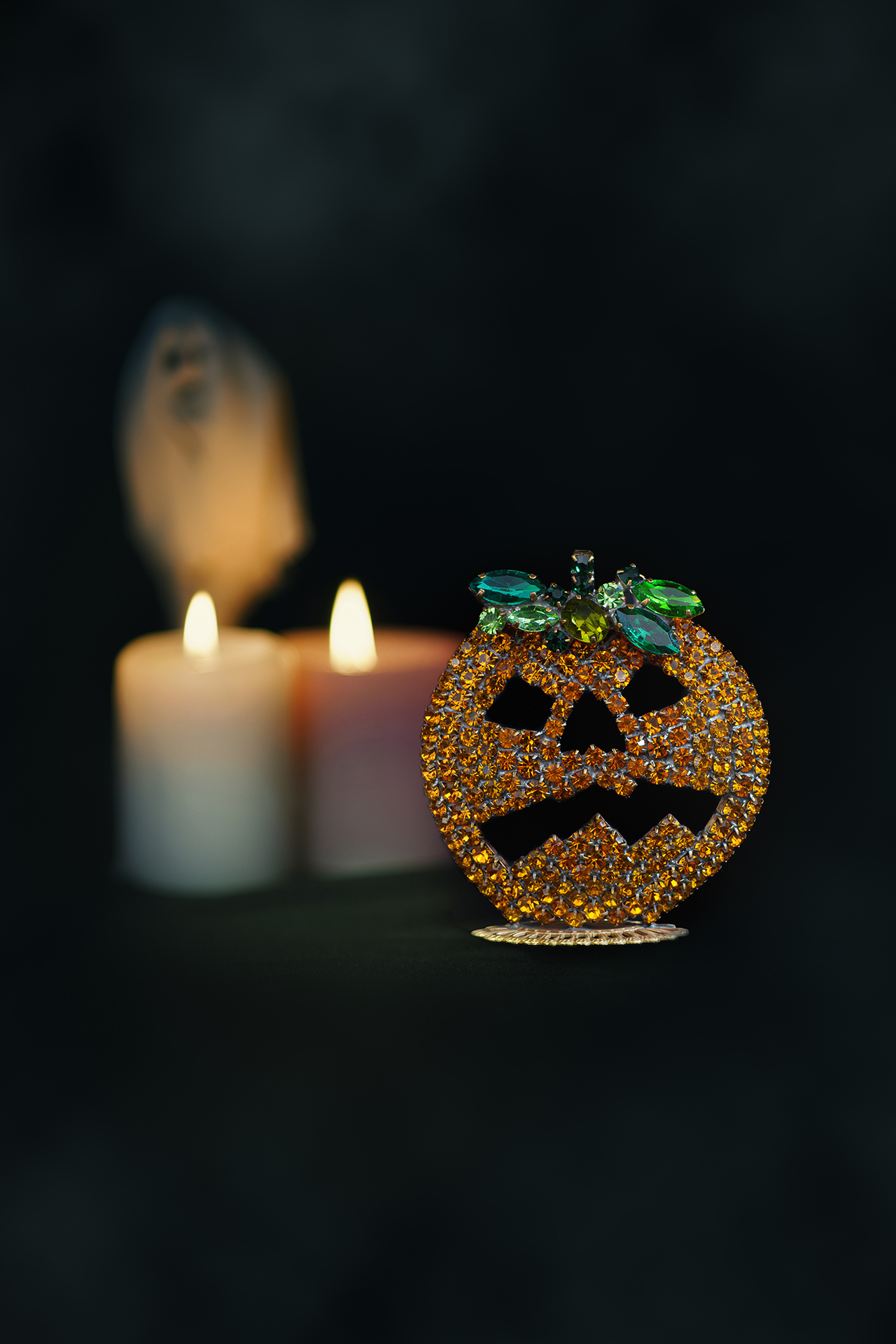 Rhinestone pumpkin with carved jack-o’-lantern face