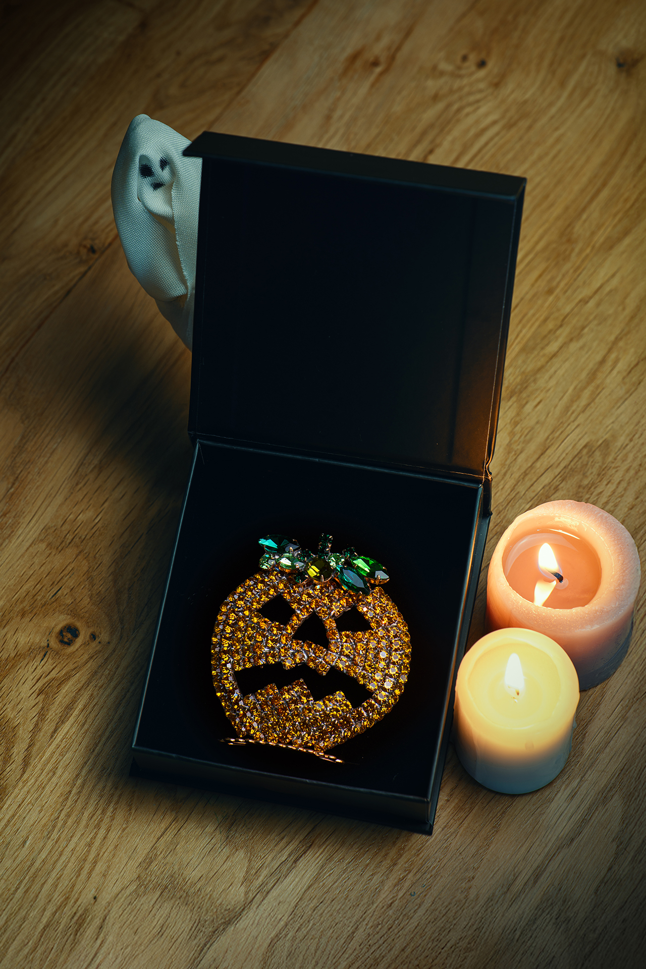 Rhinestone pumpkin with carved jack-o’-lantern face
