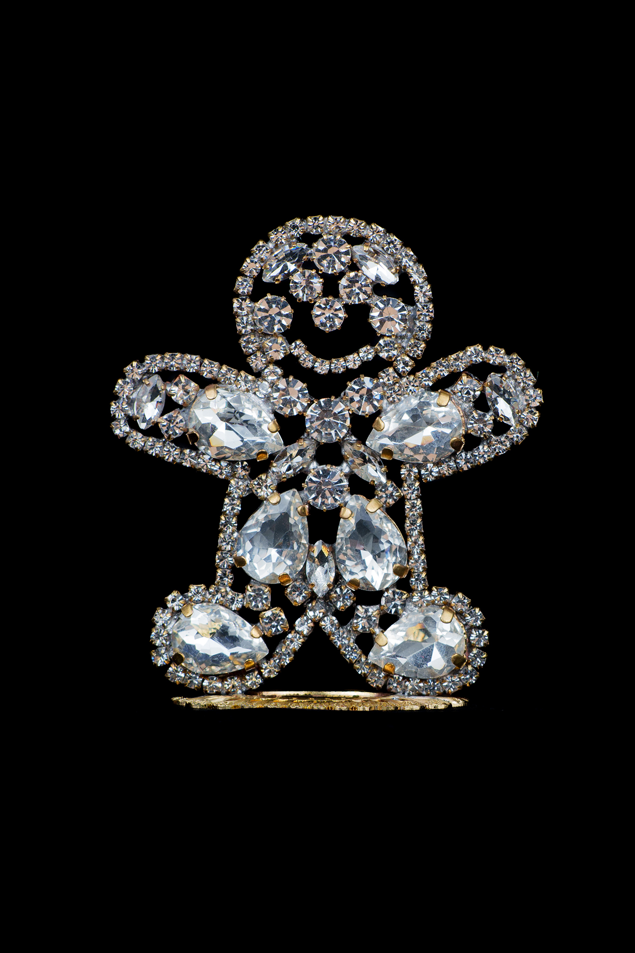 Handcrafted decorative gingerbread man made of clear rhinestones