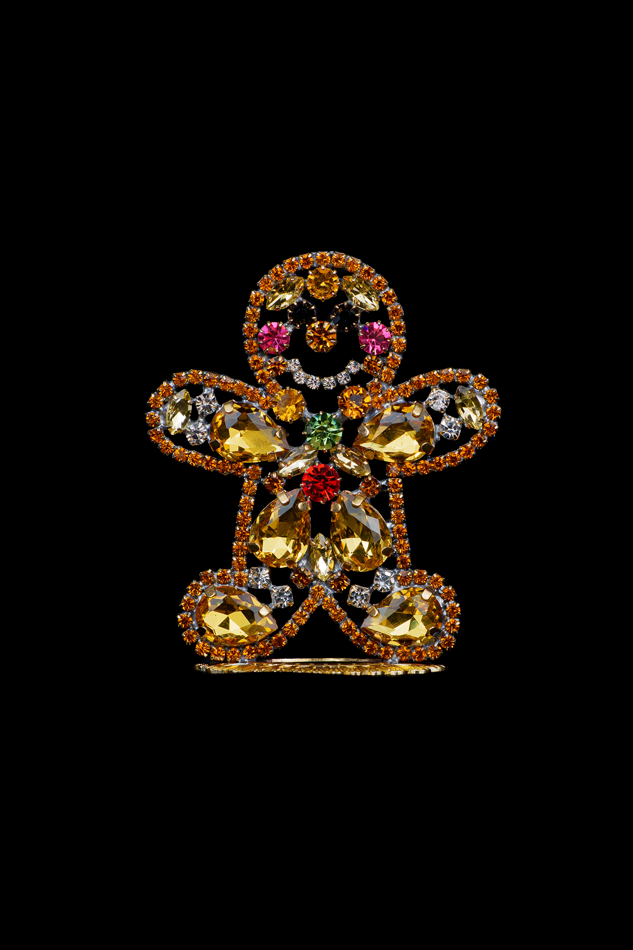 Handcrafted decorative gingerbread man made of colored rhinestones