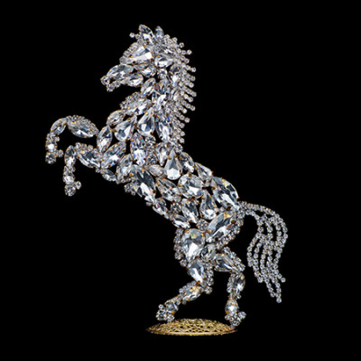 Bedazzled horse figurine made from clear rhinestones, facing to the left.