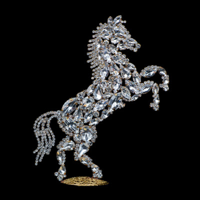 Bedazzled horse figurine made from clear rhinestones, facing to the right.