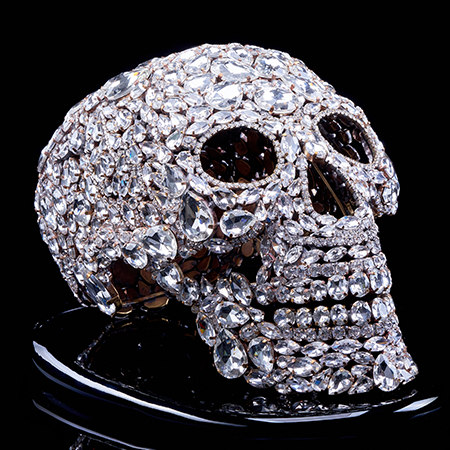 Captivating rhinestone skull with glitter decor