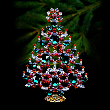 Decorated Christmas tree with red and green rhinestones ornaments.