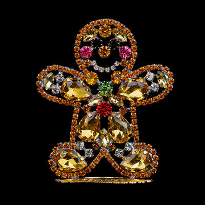 Handcrafted decorative gingerbread man made of colored rhinestones.
