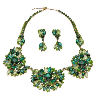 Green rhinestone necklace and earrings set with a flower motif