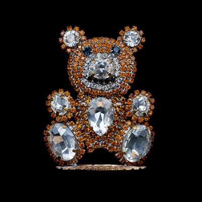 Rhinestone bear figurine made with brown and clear crystals.