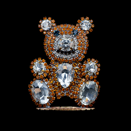 Rhinestone bear figurine made with brown and clear crystals.