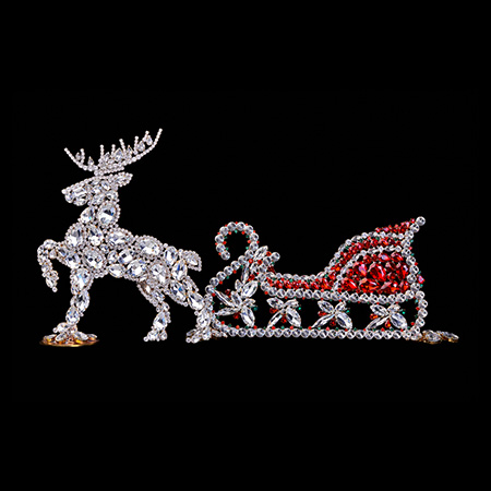 Czech handmade Christmas decoration of reindeer with sleigh.